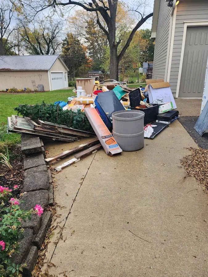 Dumpster being loaded with debris for 10 Yard Dumpster Rental in New Haven